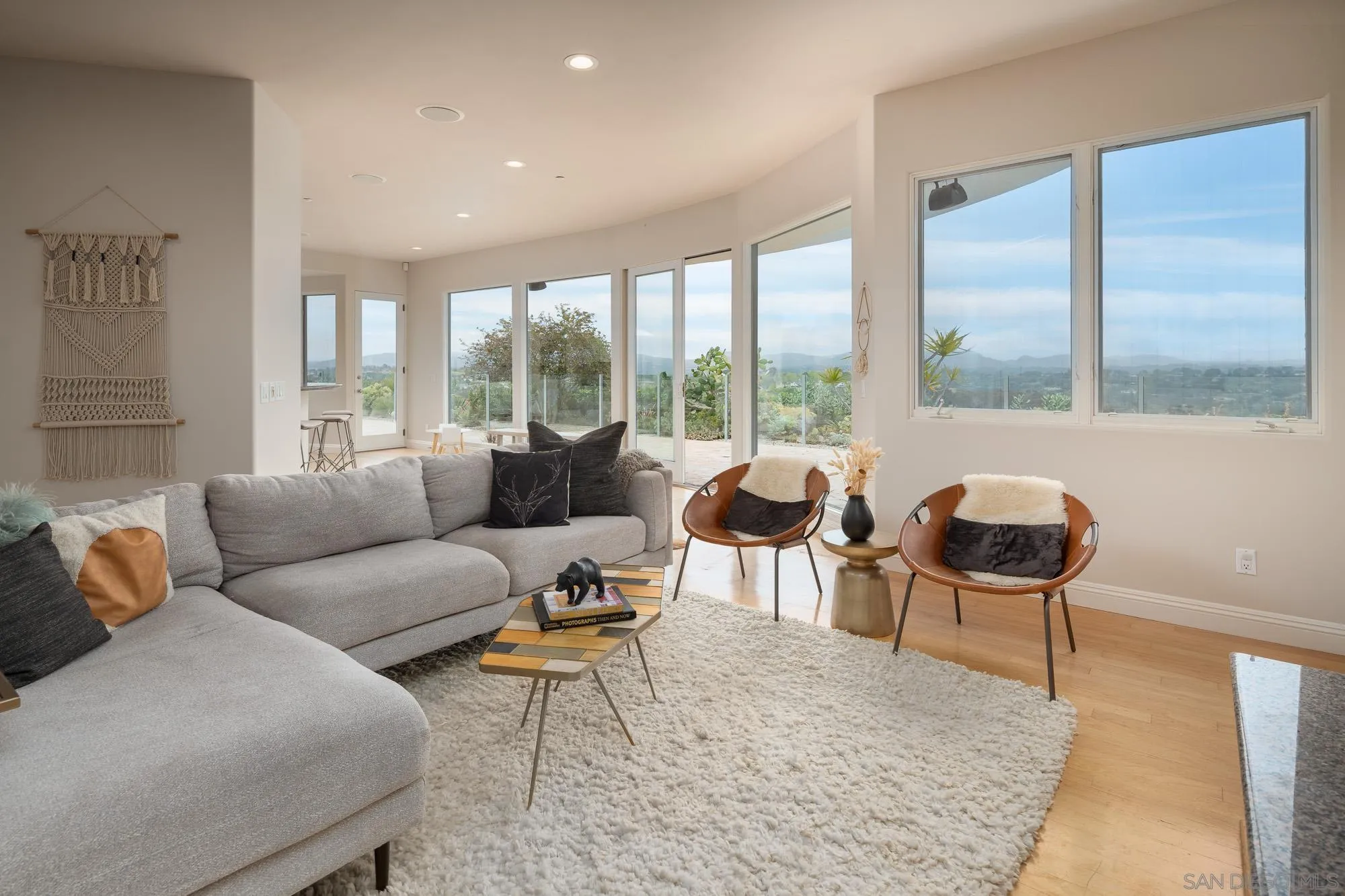 1953 Crest Drive Encinitas, CA 92024 - Photo 25 of 42 a living room with furniture and a large window