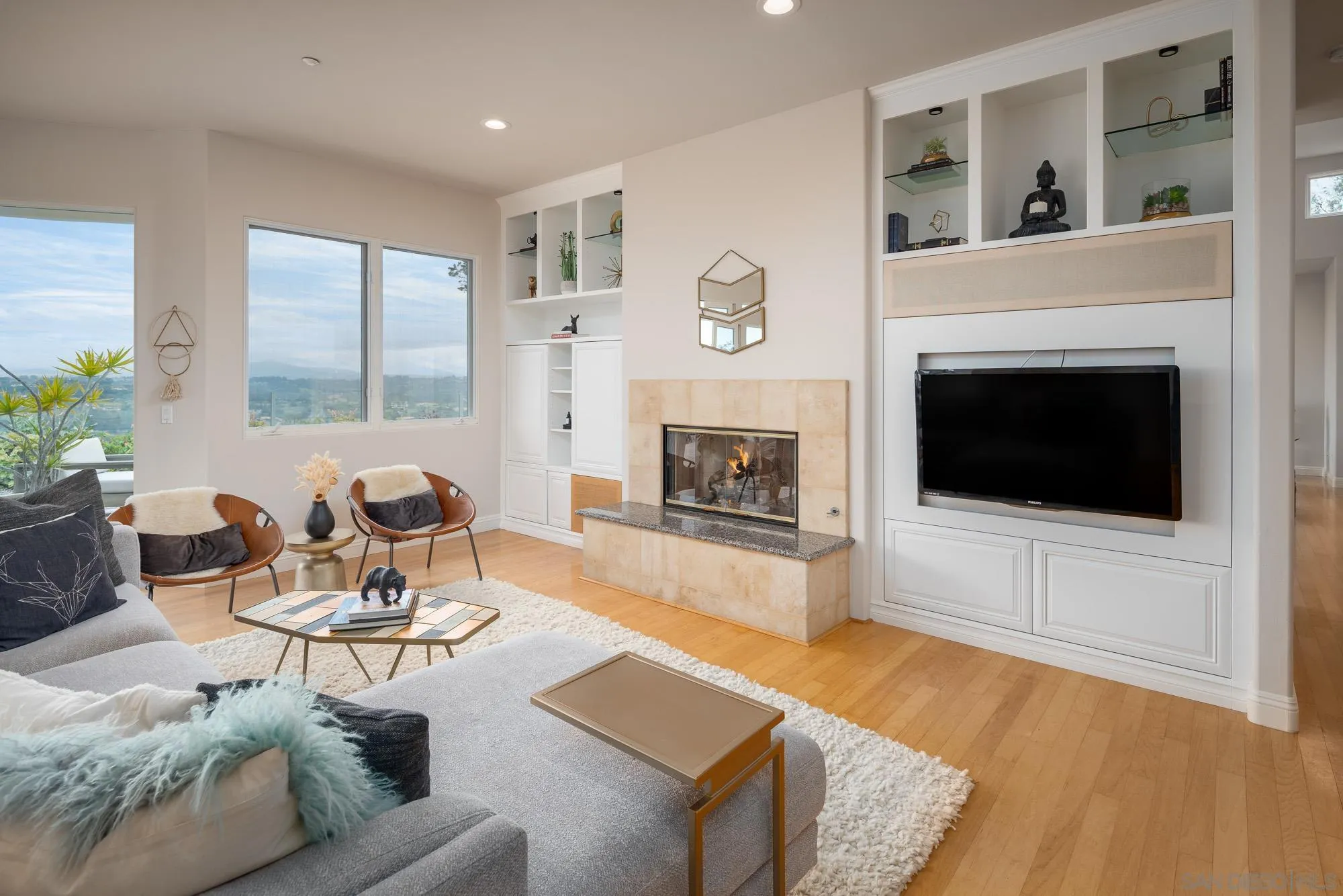 1953 Crest Drive Encinitas, CA 92024 - Photo 26 of 42 a living room with furniture fireplace and window
