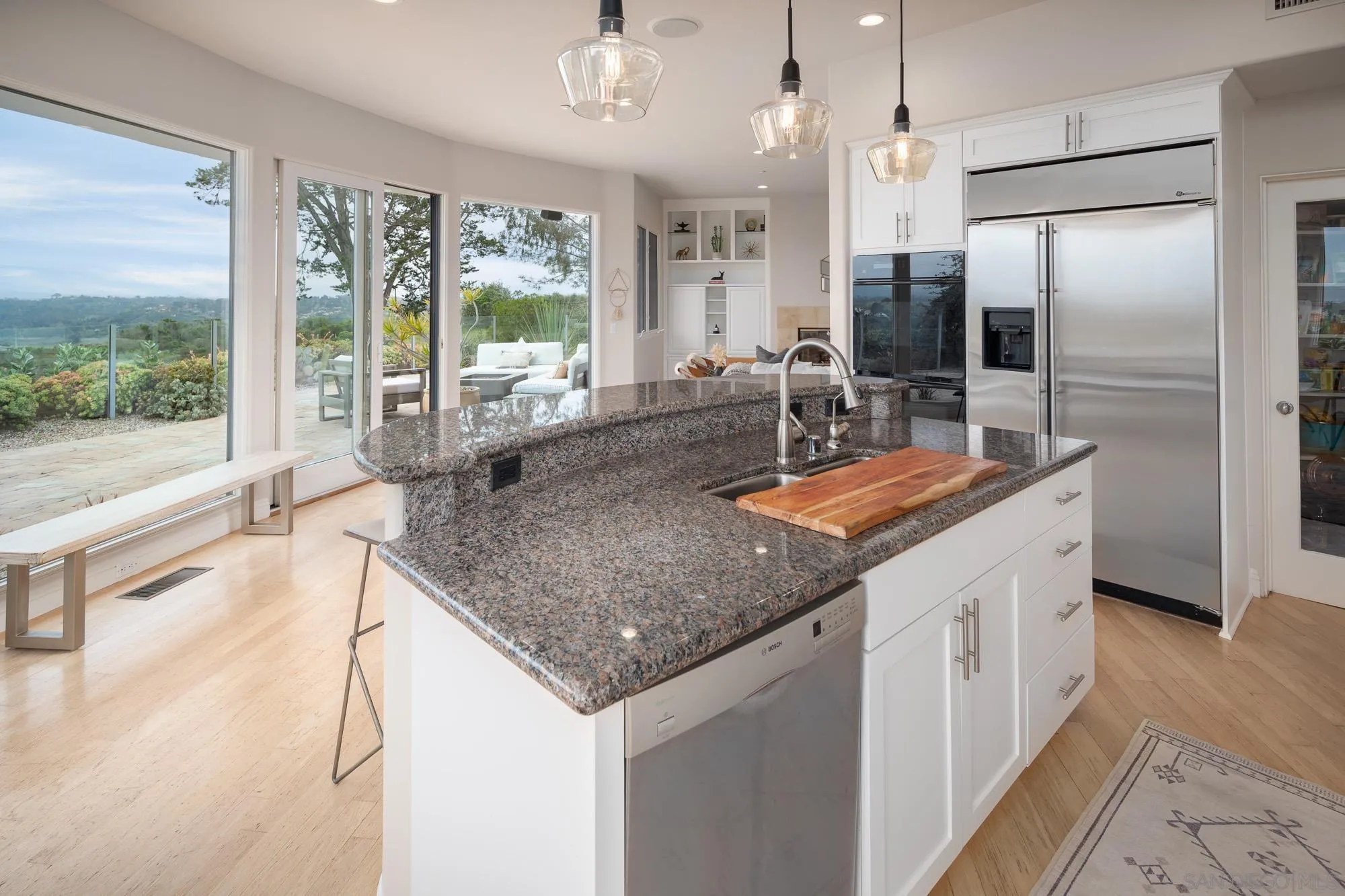 1953 Crest Drive Encinitas, CA 92024 - Photo 28 of 42 a kitchen with stainless steel appliances granite countertop a sink and a refrigerator
