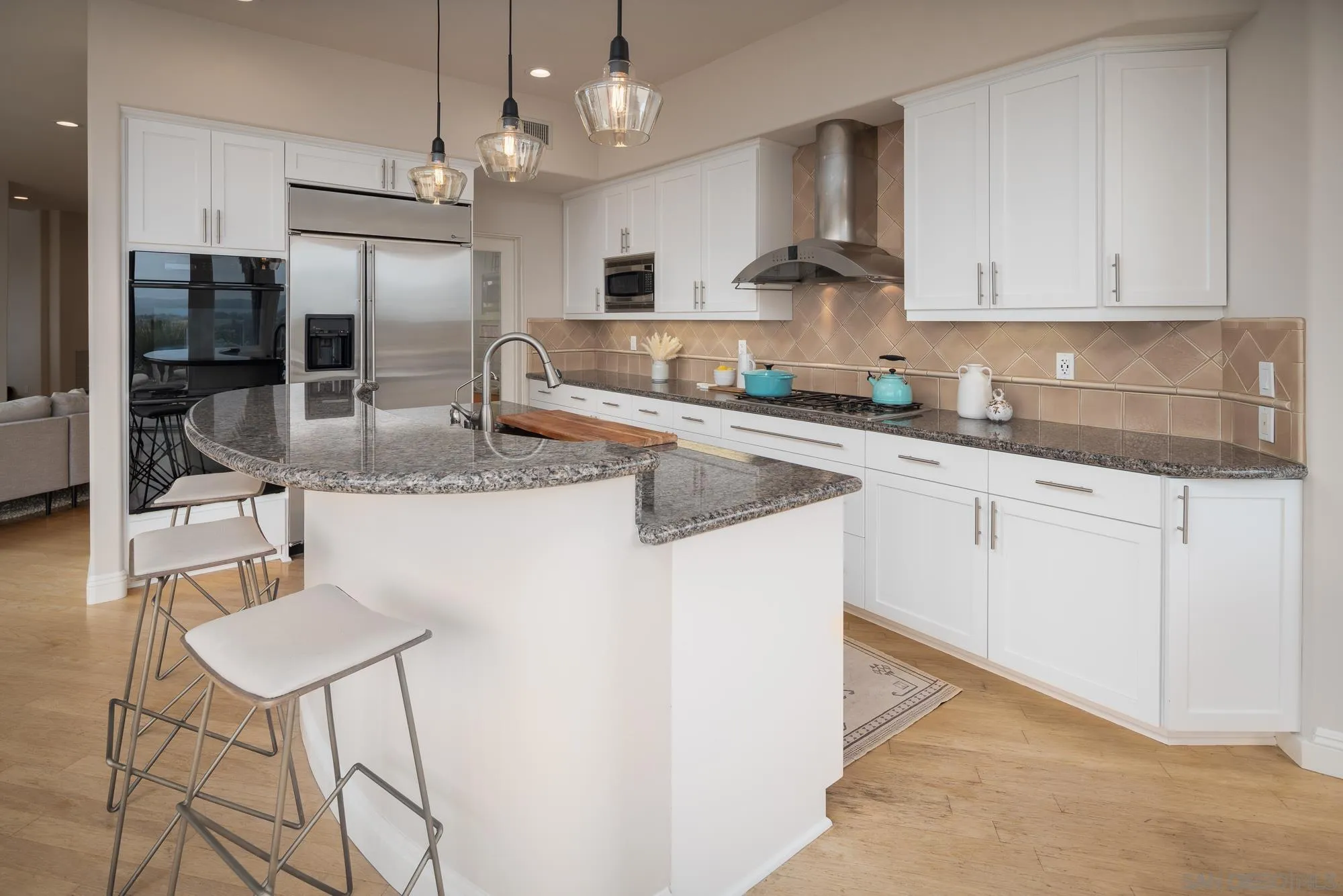 1953 Crest Drive Encinitas, CA 92024 - Photo 30 of 42 a kitchen with stainless steel appliances granite countertop a sink a stove a refrigerator cabinets and chairs