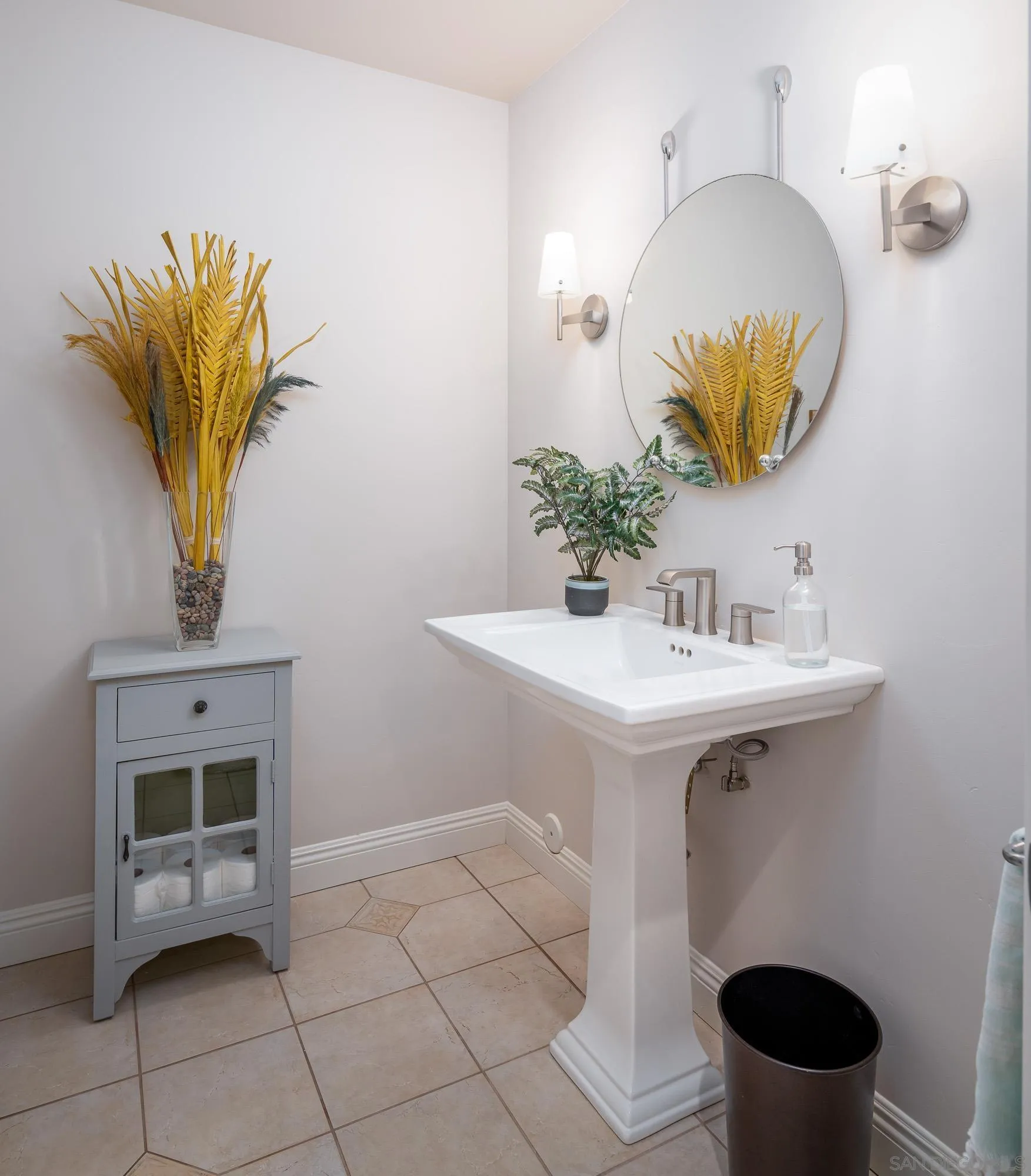 1953 Crest Drive Encinitas, CA 92024 - Photo 36 of 42 a bathroom with a sink mirror and toilet