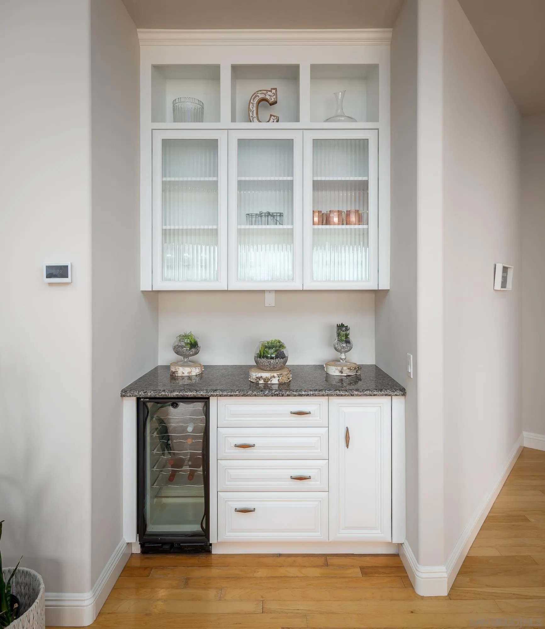 1953 Crest Drive Encinitas, CA 92024 - Photo 37 of 42 a kitchen with granite countertop a stove and a cabinets