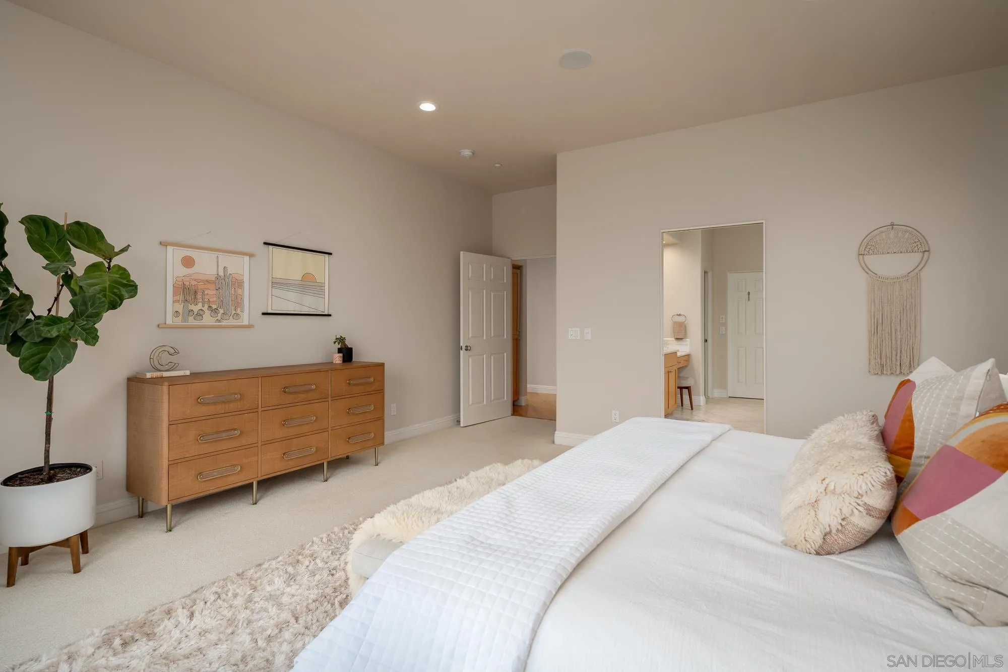 1953 Crest Drive Encinitas, CA 92024 - Photo 39 of 42 a bedroom with a bed dresser and a window
