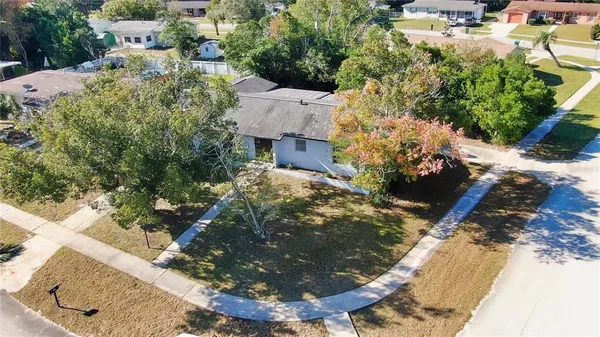 an aerial view of residential house with outdoor space