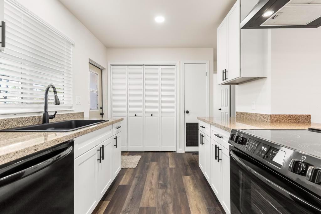 7600 Golden Eye Lane, Unit 43 Citrus Heights, CA 95621 - Photo 12 of 39 a kitchen with granite countertop a sink stove and cabinets
