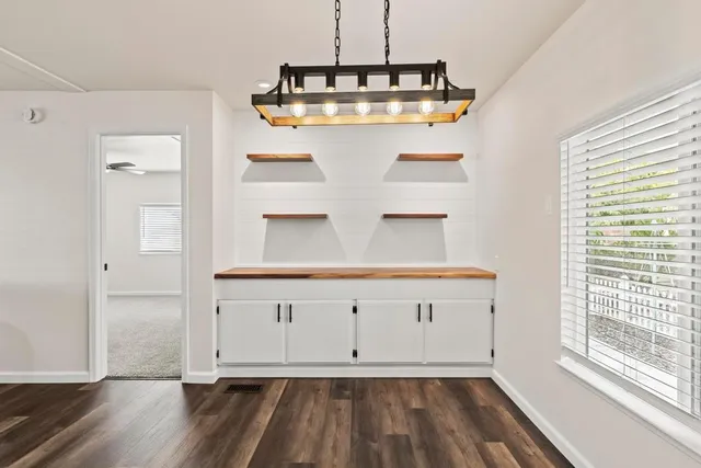 a view of room with wooden floor and window