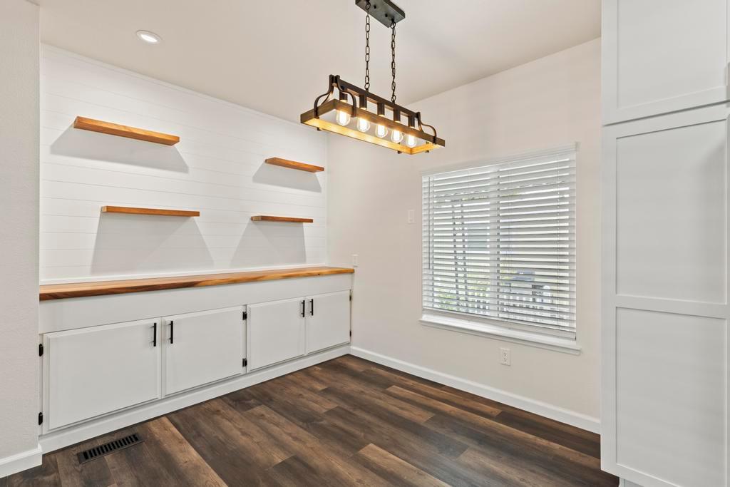 7600 Golden Eye Lane, Unit 43 Citrus Heights, CA 95621 - Photo 15 of 39 a view of an empty room with a window and wooden floor
