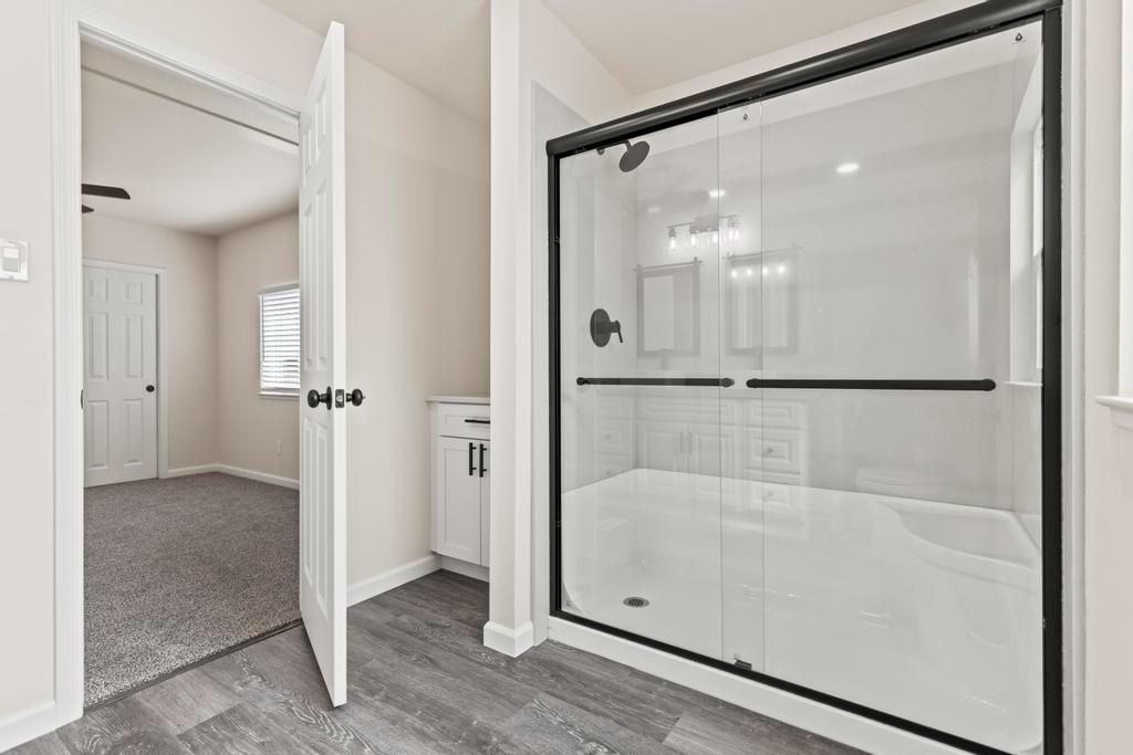7600 Golden Eye Lane, Unit 43 Citrus Heights, CA 95621 - Photo 21 of 39 a bathroom with a glass shower door
