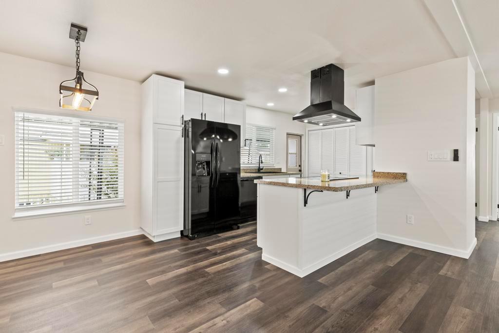 7600 Golden Eye Lane, Unit 43 Citrus Heights, CA 95621 - Photo 3 of 39 a view of a kitchen with wooden floor