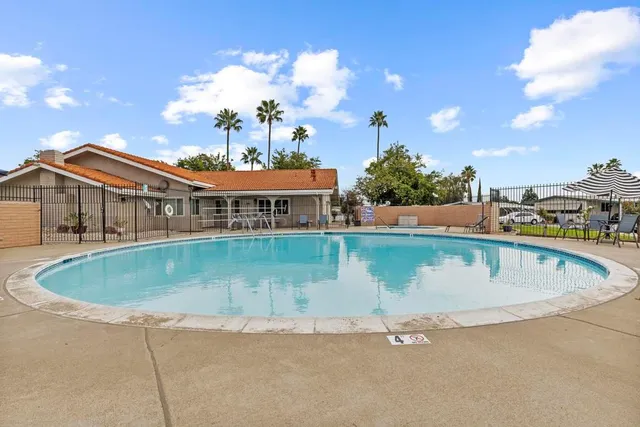a view of a swimming pool with a lake view
