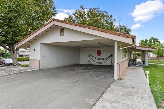 a view of a house with a yard and garage