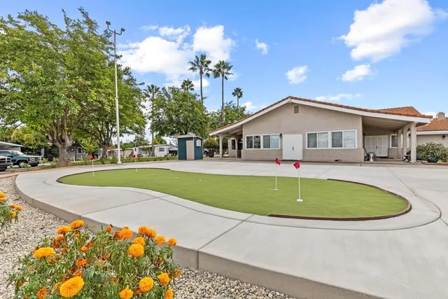 a view of pool with garden