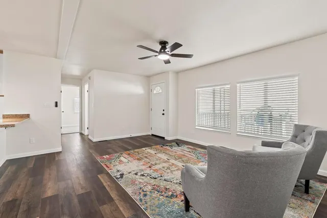 a living room with a couch and a chandelier