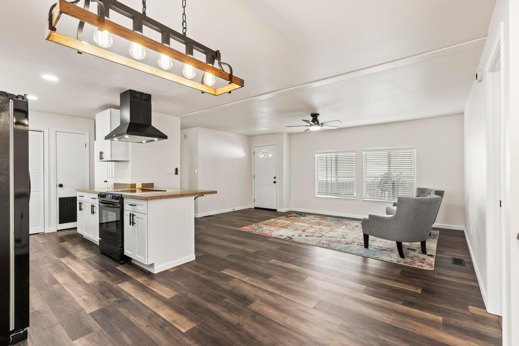 7600 Golden Eye Lane, Unit 43 Citrus Heights, CA 95621 - Photo 9 of 39 a living room with furniture and a wooden floor