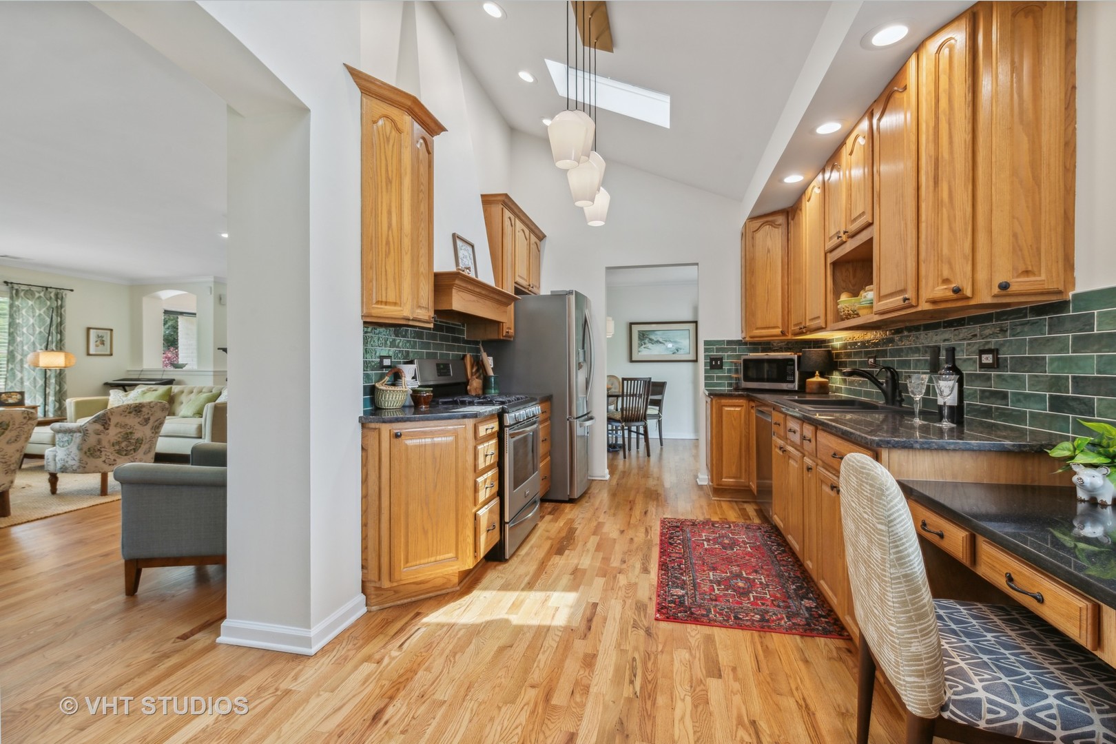 831 Ela Road Inverness, IL 60067 - Photo 12 of 46 a kitchen with stainless steel appliances granite countertop lots of counter top space and wooden floor