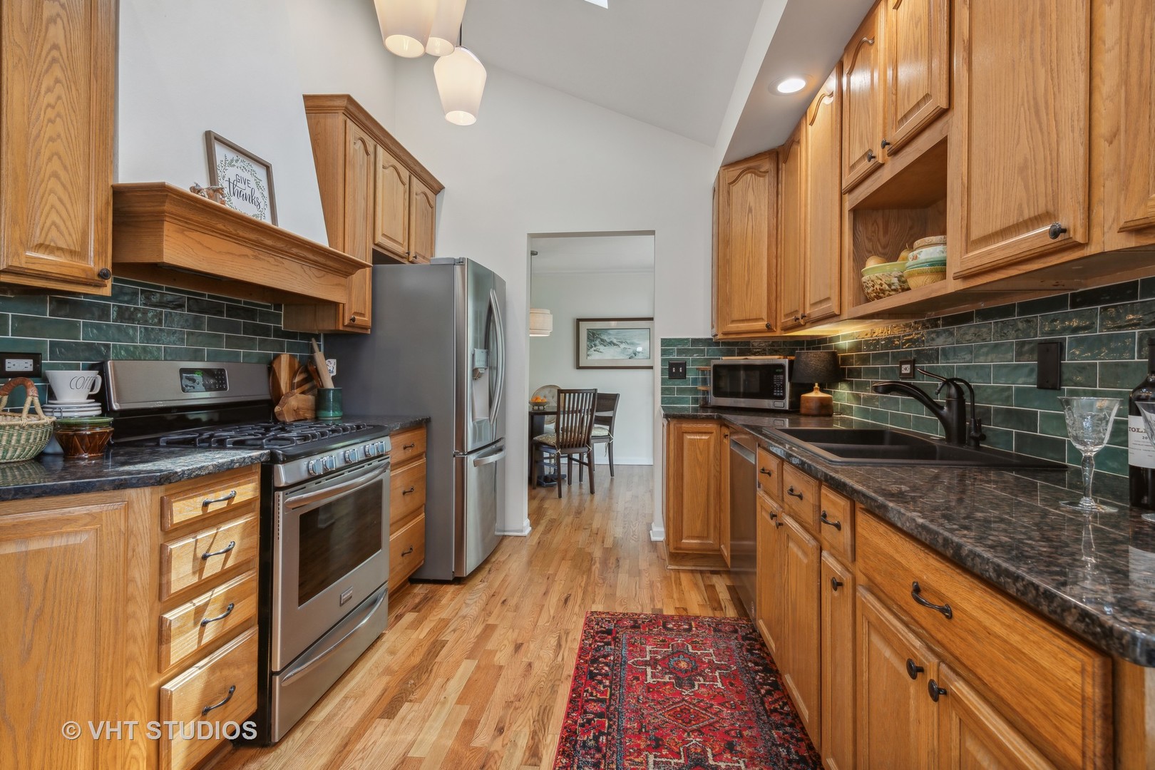 831 Ela Road Inverness, IL 60067 - Photo 13 of 46 a kitchen with stainless steel appliances granite countertop a stove a sink dishwasher and a refrigerator
