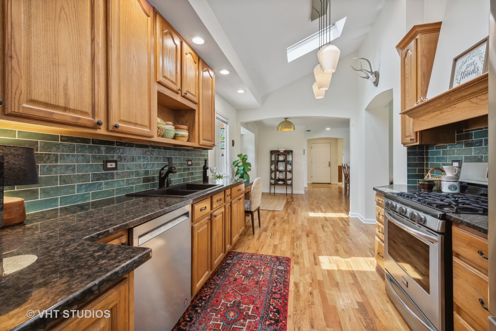 831 Ela Road Inverness, IL 60067 - Photo 14 of 46 a large kitchen with stainless steel appliances granite countertop a stove and a sink