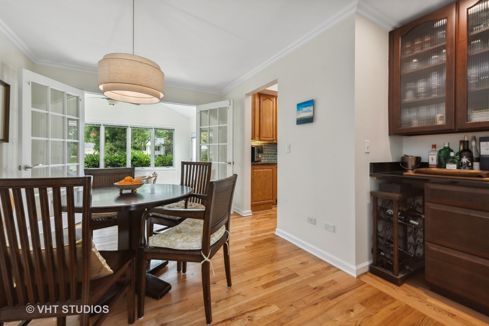 831 Ela Road Inverness, IL 60067 - Photo 16 of 46 a view of a dining room with furniture window and wooden floor