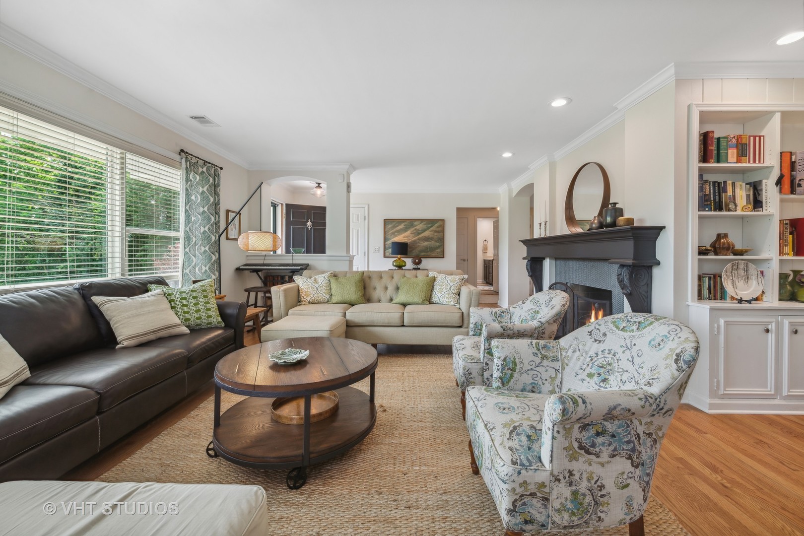 831 Ela Road Inverness, IL 60067 - Photo 22 of 46 a living room with furniture a fireplace and a large window