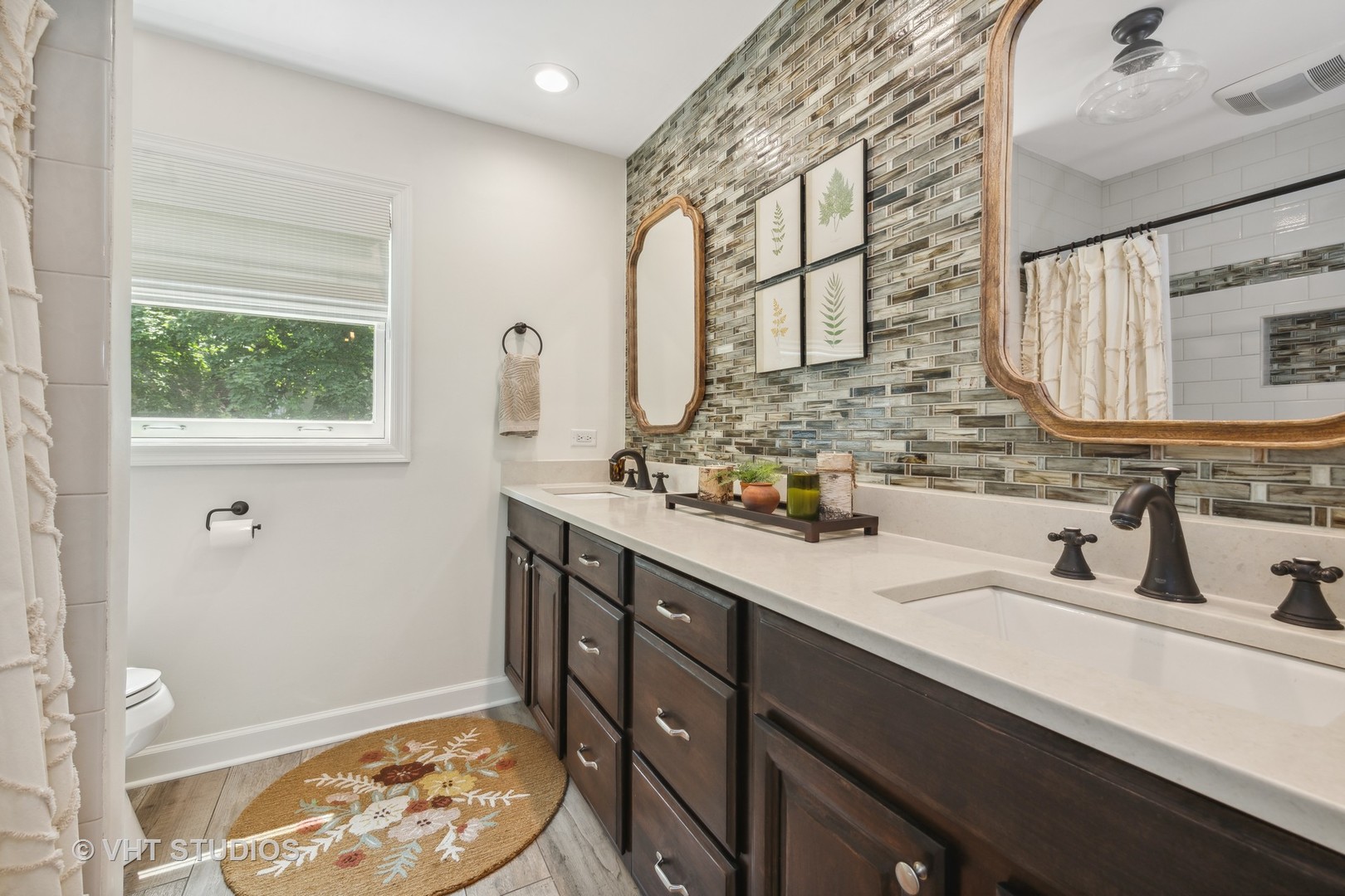 831 Ela Road Inverness, IL 60067 - Photo 27 of 46 a bathroom with a sink a vanity and a mirror