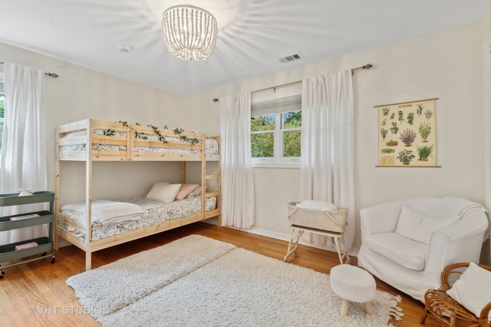 831 Ela Road Inverness, IL 60067 - Photo 28 of 46 a bedroom with a bed and a chandelier