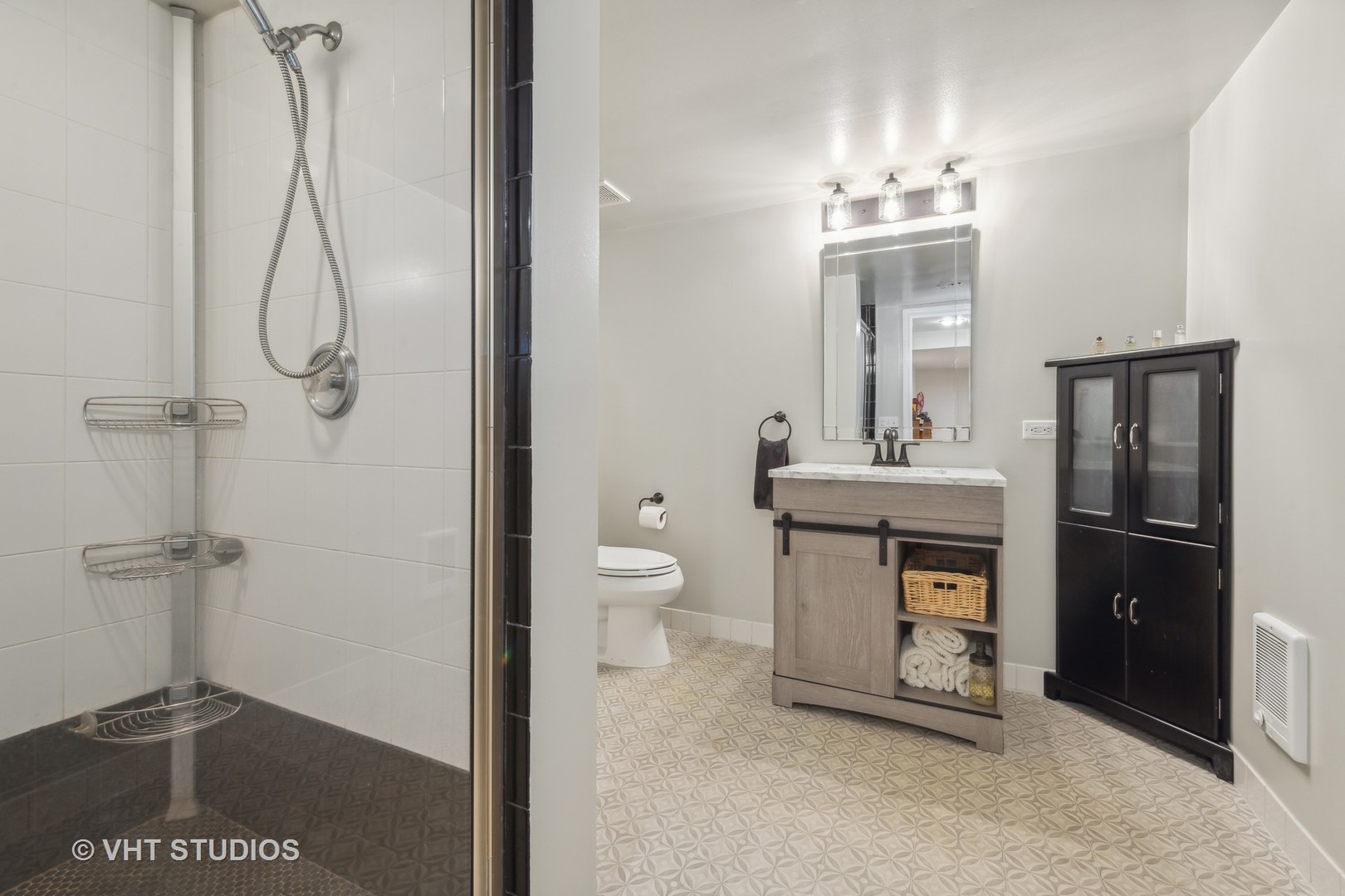 831 Ela Road Inverness, IL 60067 - Photo 31 of 46 a bathroom with a granite countertop sink a toilet and a mirror