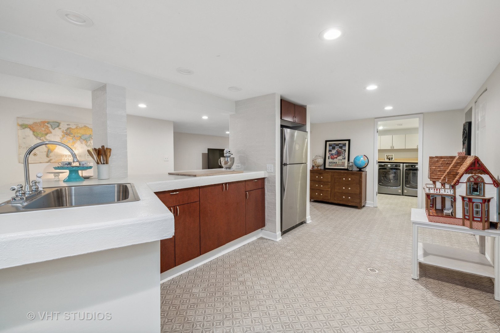 831 Ela Road Inverness, IL 60067 - Photo 33 of 46 a large white kitchen with stainless steel appliances kitchen island a large counter top and a sink