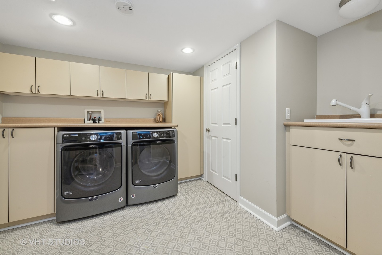 831 Ela Road Inverness, IL 60067 - Photo 35 of 46 a utility room with cabinets washer and dryer