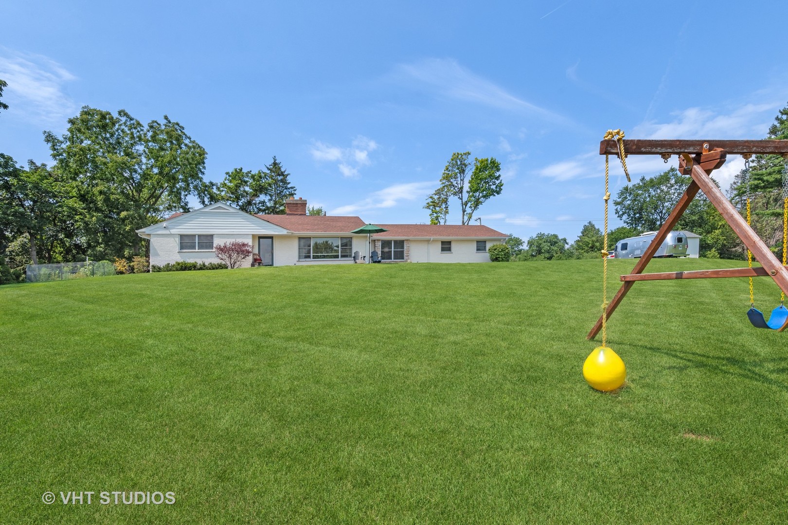 831 Ela Road Inverness, IL 60067 - Photo 36 of 46 a backyard of a house with table and chairs