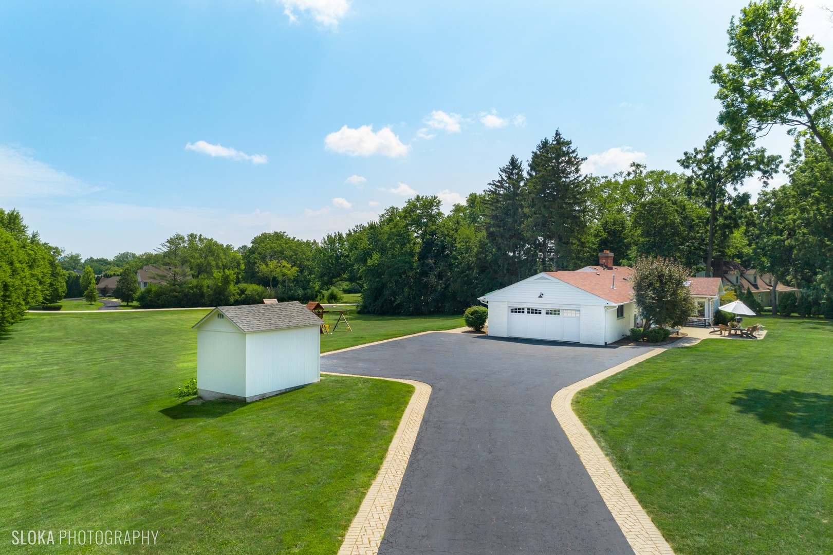 831 Ela Road Inverness, IL 60067 - Photo 38 of 46 a house view with a garden space