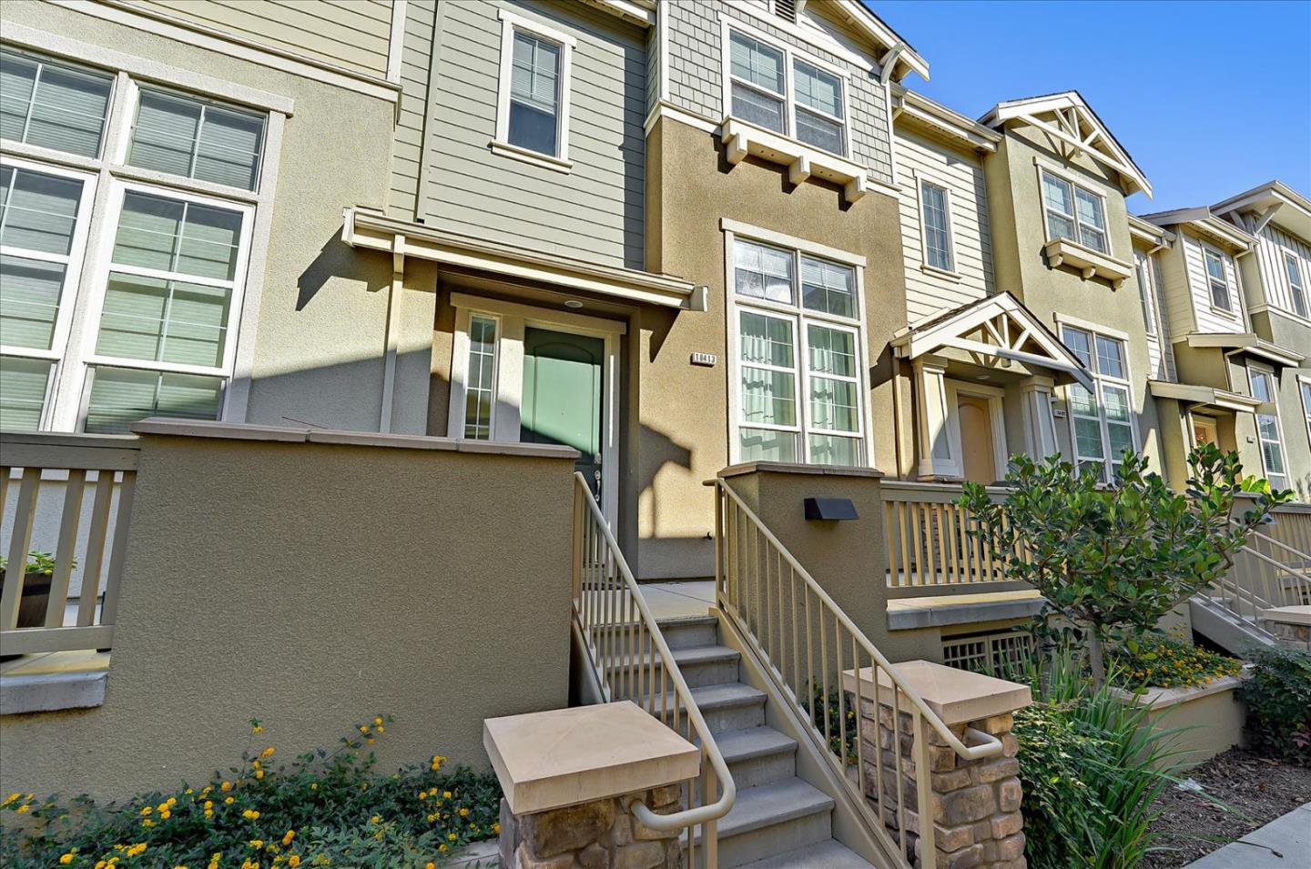 a balcony with table and chairs
