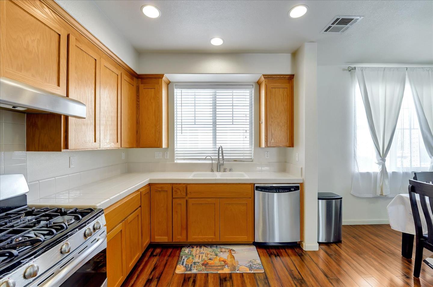 18413 Ruby Lane Morgan Hill, CA 95037 - Photo 12 of 33 a kitchen with granite countertop a stove and a sink