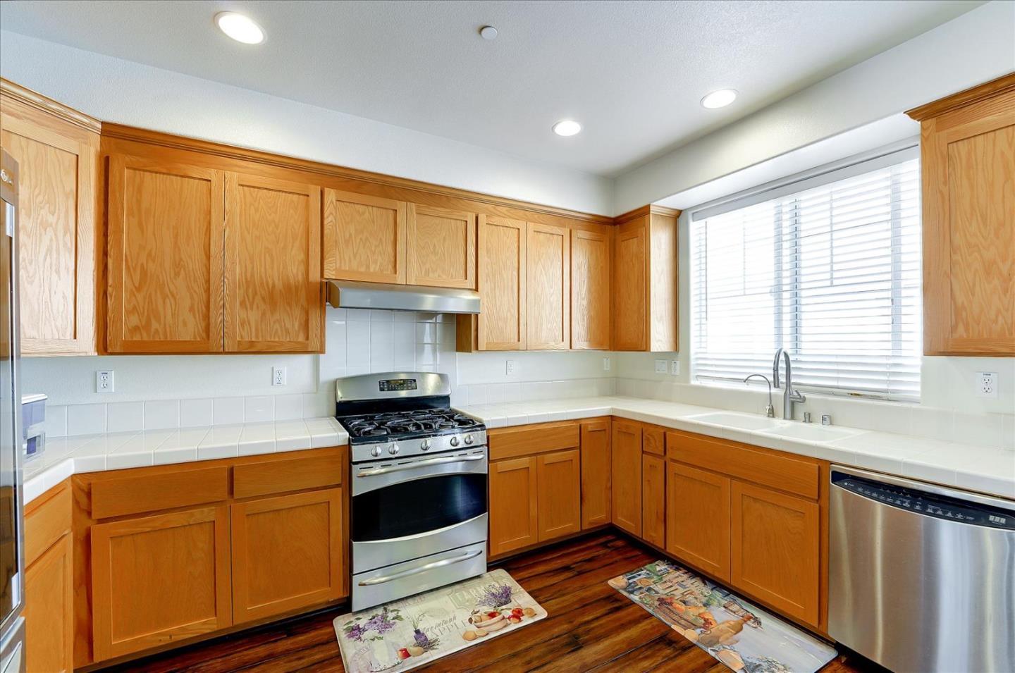 18413 Ruby Lane Morgan Hill, CA 95037 - Photo 13 of 33 a kitchen with granite countertop a sink stainless steel appliances and cabinets