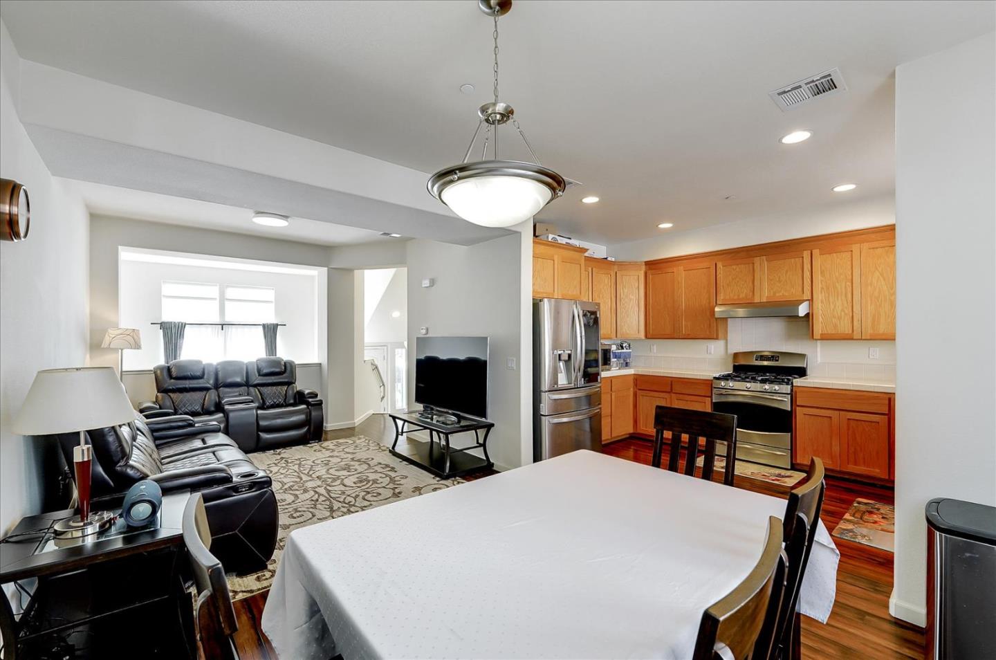 18413 Ruby Lane Morgan Hill, CA 95037 - Photo 16 of 33 a kitchen and a dining table with chairs