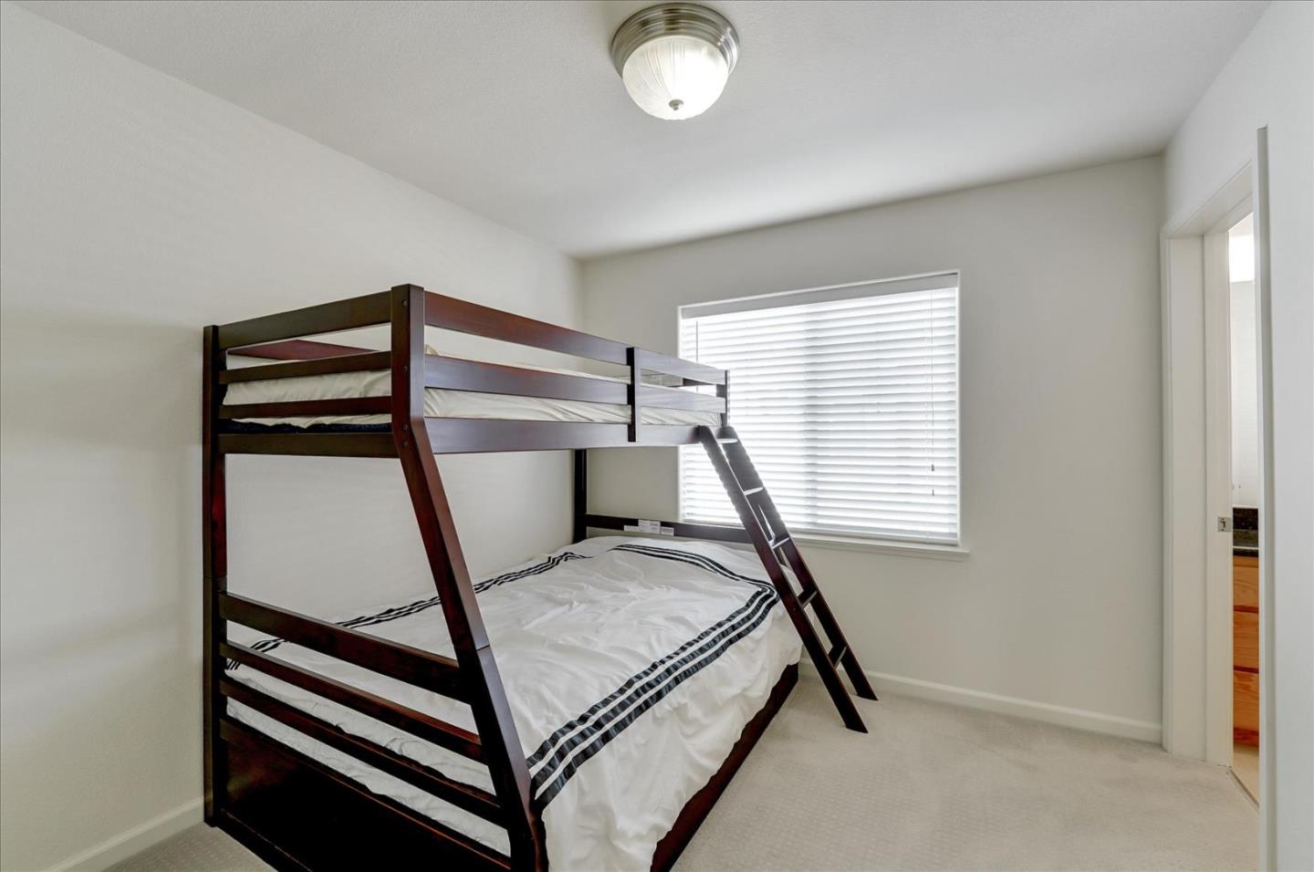 18413 Ruby Lane Morgan Hill, CA 95037 - Photo 20 of 33 a room with a chair and white walls