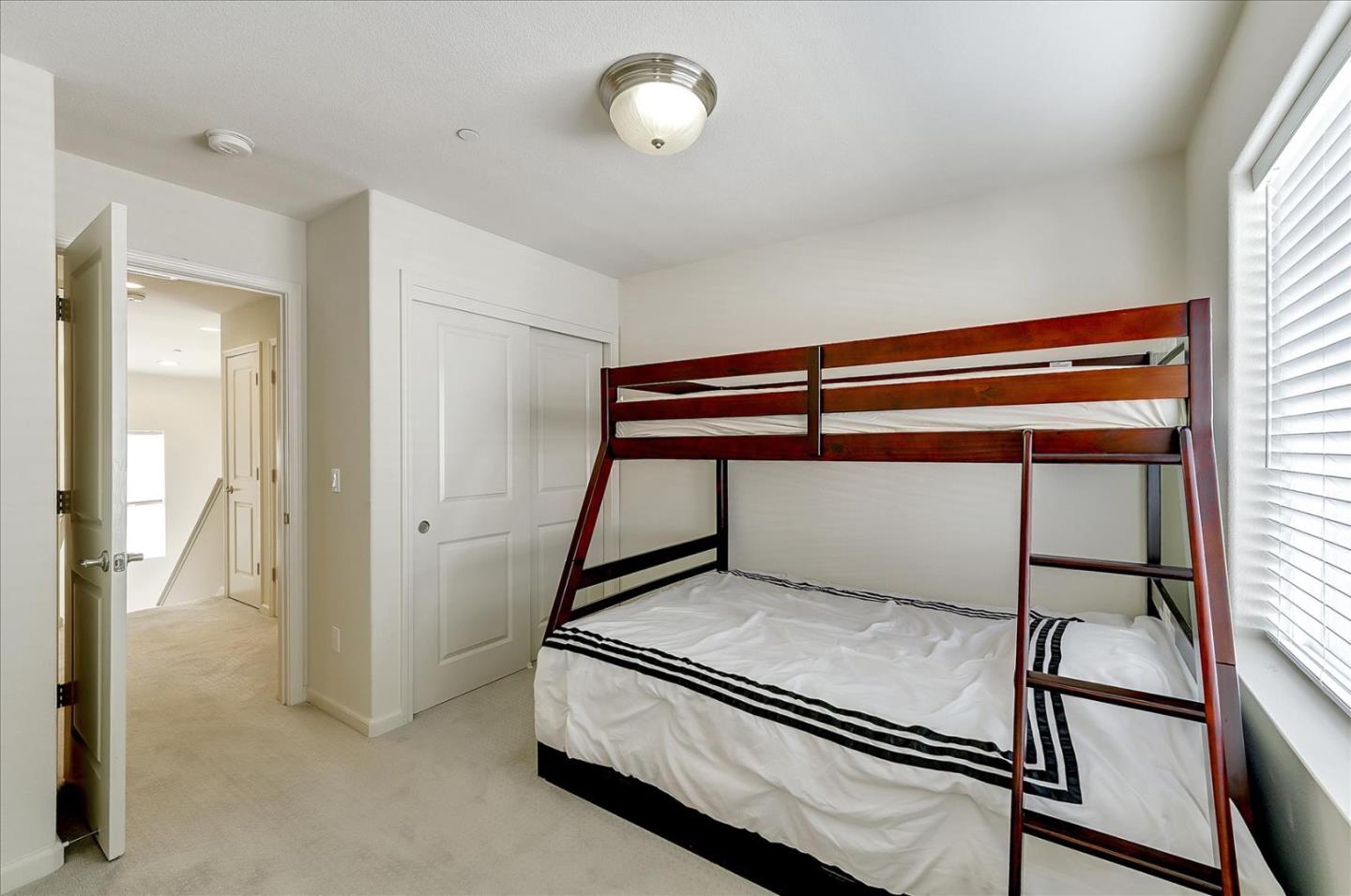 18413 Ruby Lane Morgan Hill, CA 95037 - Photo 21 of 33 a room with a bunk bed and a window