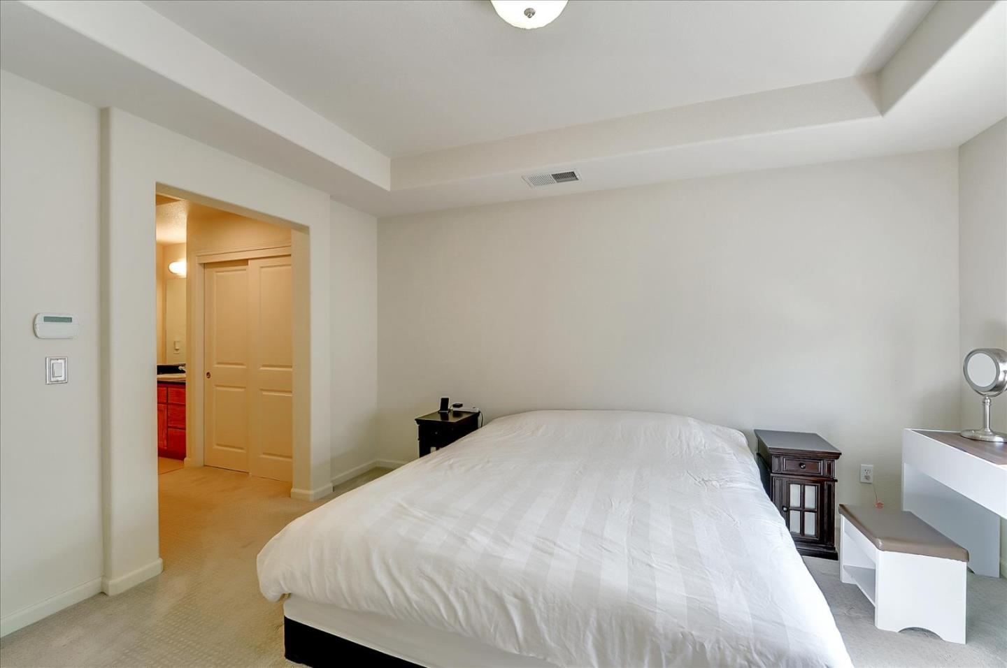 18413 Ruby Lane Morgan Hill, CA 95037 - Photo 23 of 33 a bedroom with a bed and a table in it