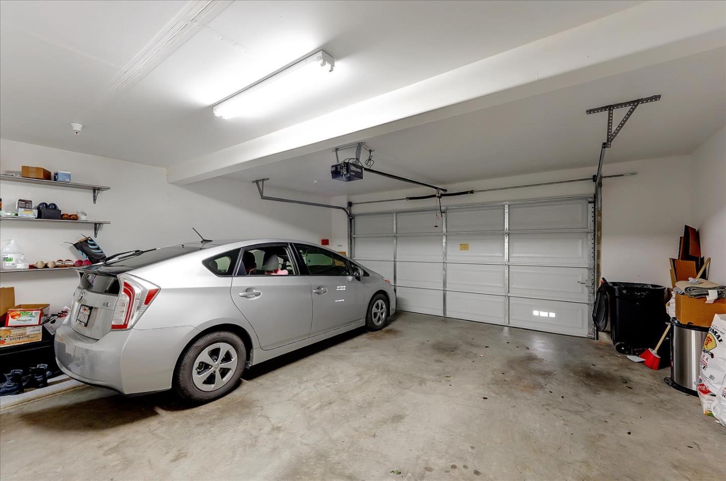 18413 Ruby Lane Morgan Hill, CA 95037 - Photo 32 of 33 a car and bike parked in a garage