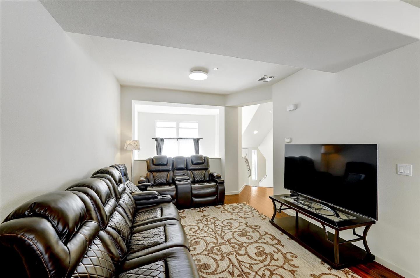 18413 Ruby Lane Morgan Hill, CA 95037 - Photo 9 of 33 a living room with furniture and a flat screen tv