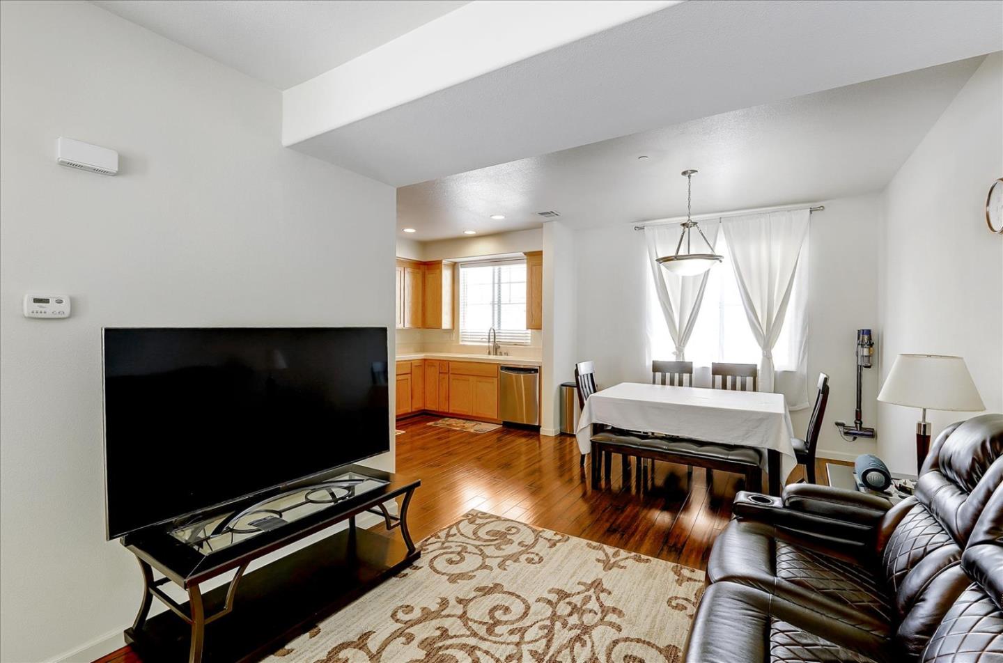 18413 Ruby Lane Morgan Hill, CA 95037 - Photo 10 of 33 a living room with furniture a flat screen tv and a window