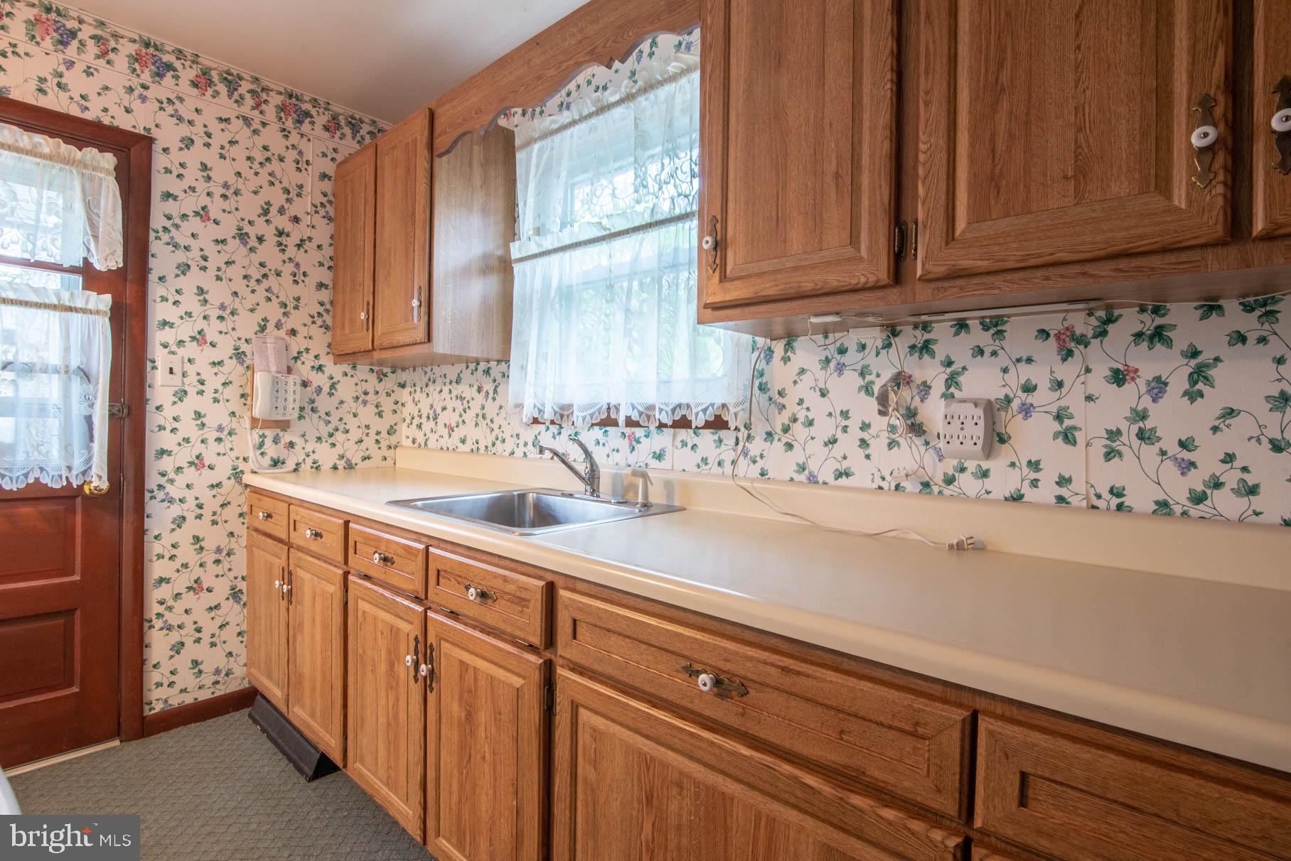 5061 Rippling Run Road Red Lion, PA 17356 - Photo 11 of 44 a bathroom with a sink and a mirror