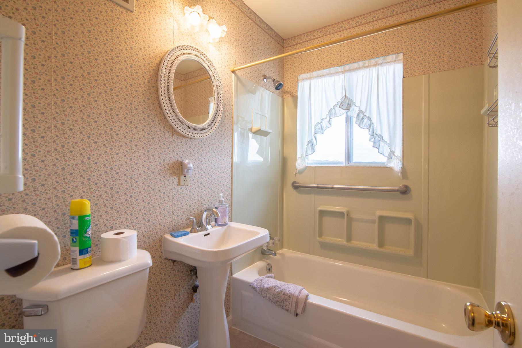 5061 Rippling Run Road Red Lion, PA 17356 - Photo 13 of 44 a bathroom with a sink a toilet and a bathtub