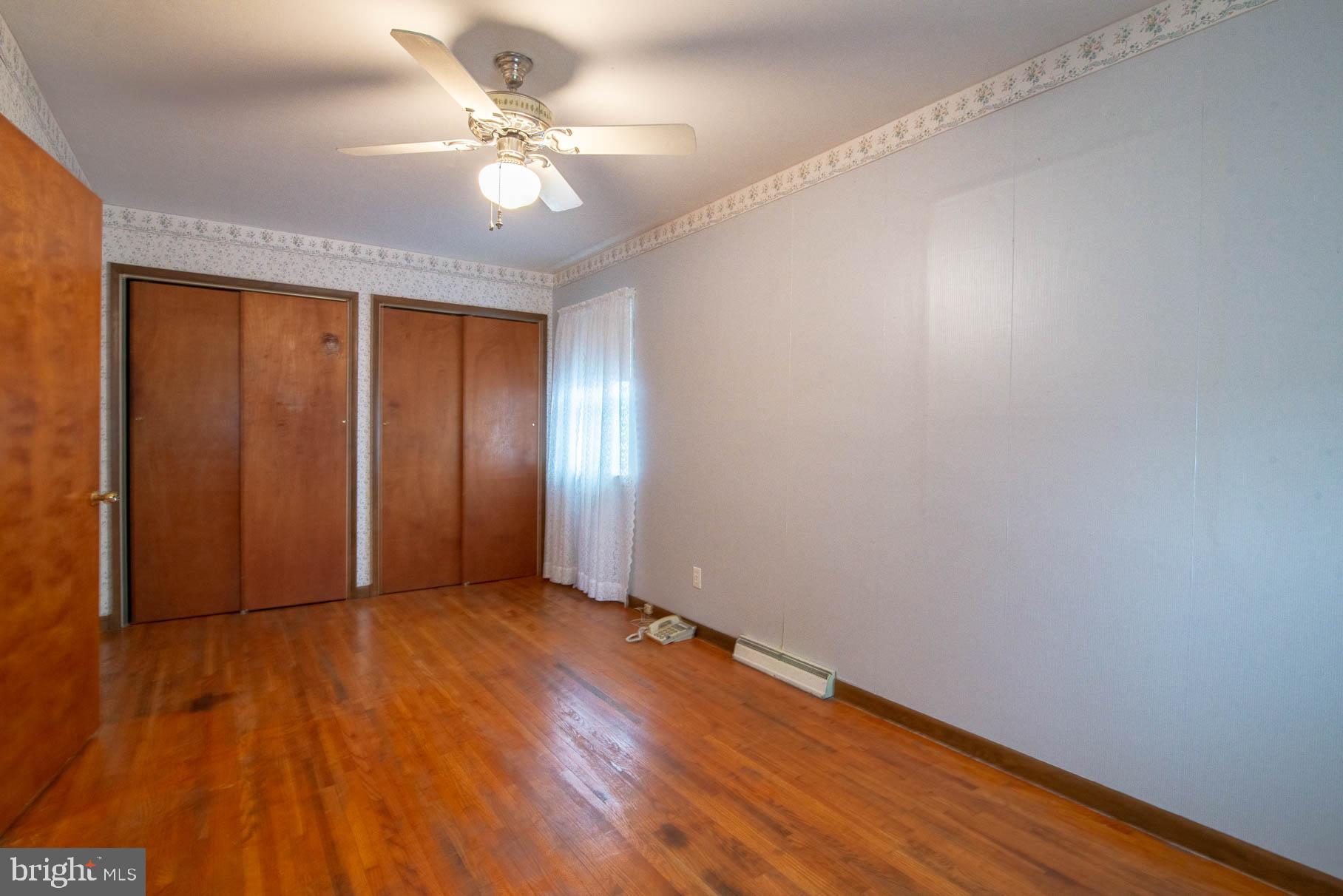 5061 Rippling Run Road Red Lion, PA 17356 - Photo 17 of 44 a view of an empty room with wooden floor