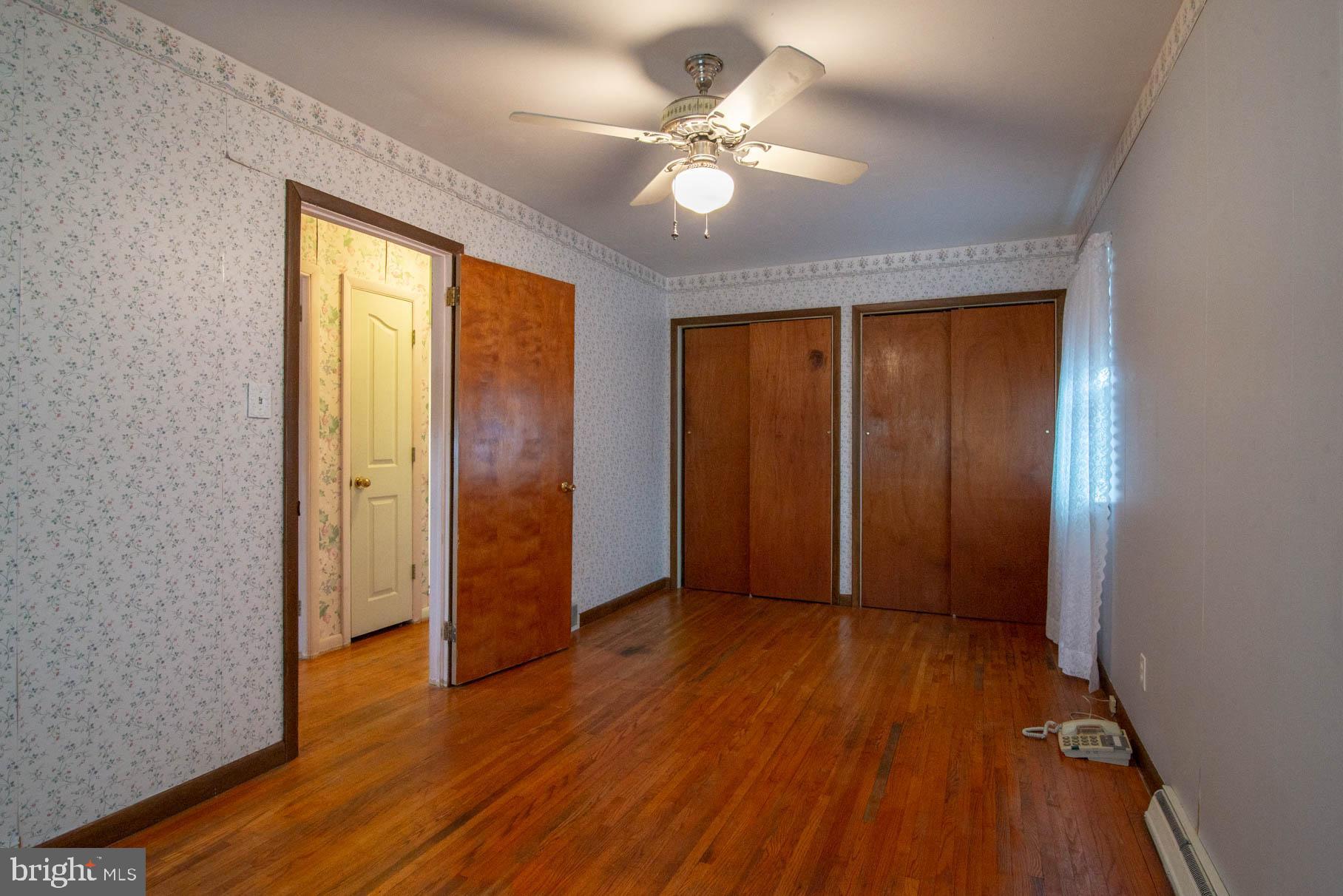 5061 Rippling Run Road Red Lion, PA 17356 - Photo 18 of 44 wooden floor in an empty room with a window
