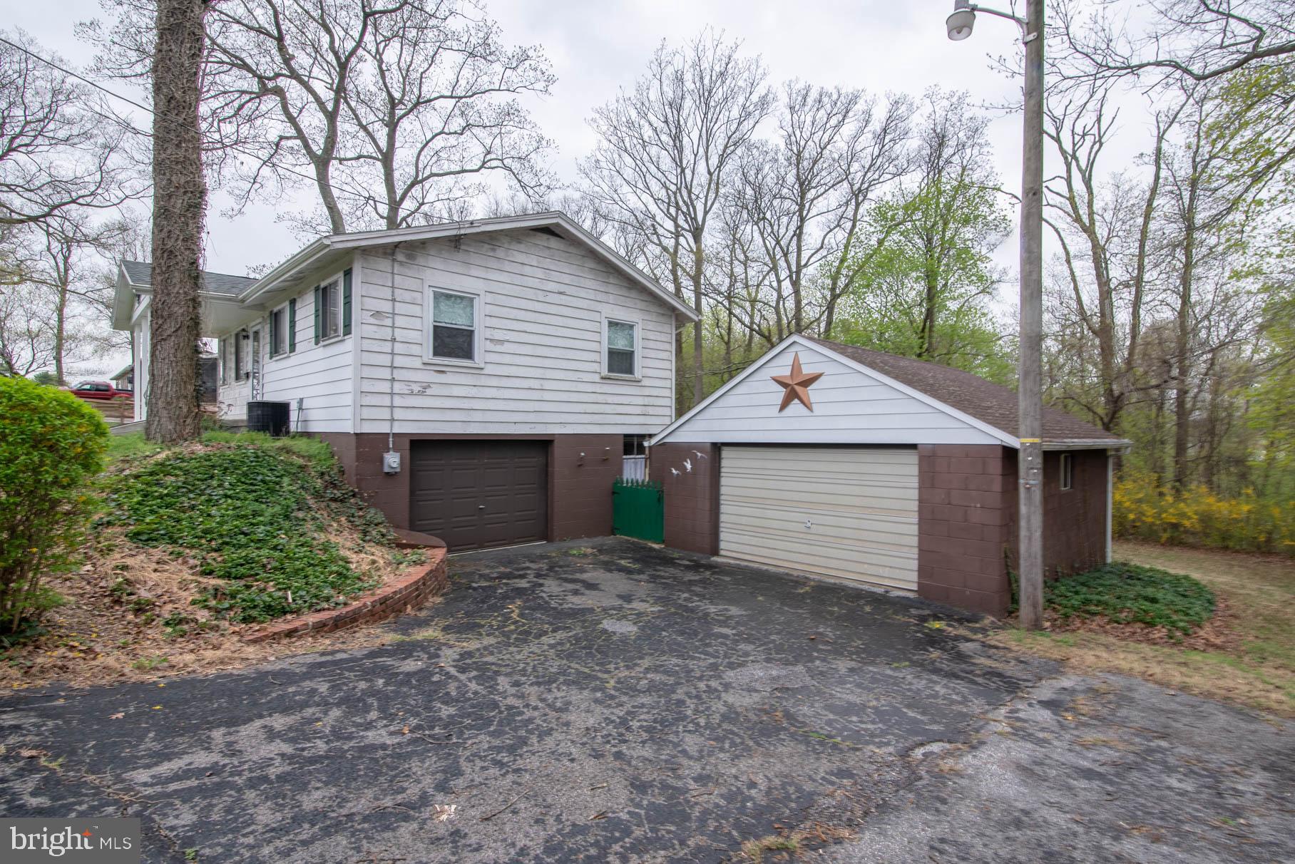 5061 Rippling Run Road Red Lion, PA 17356 - Photo 4 of 44 a view of a house with a yard and large tree