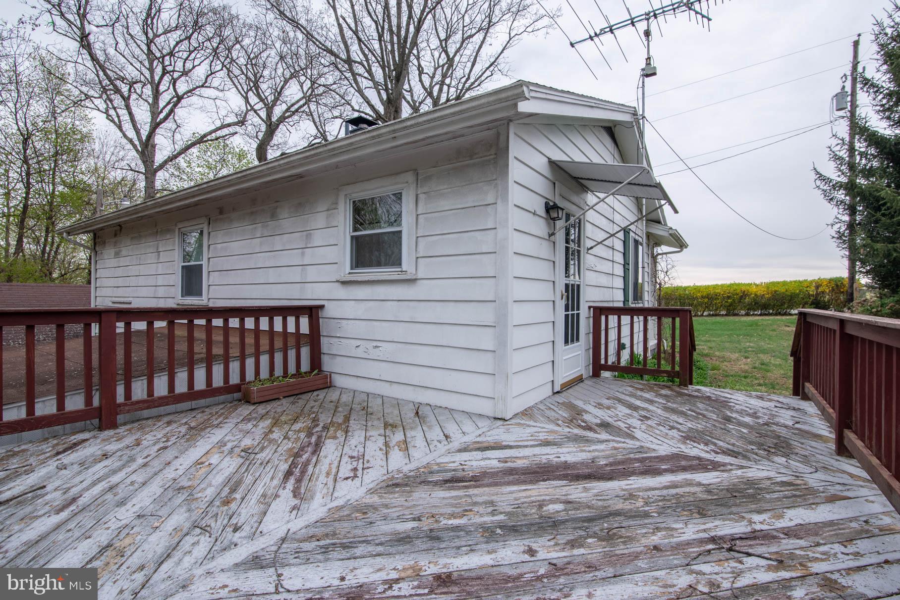 5061 Rippling Run Road Red Lion, PA 17356 - Photo 34 of 44 a side view of a house with a yard