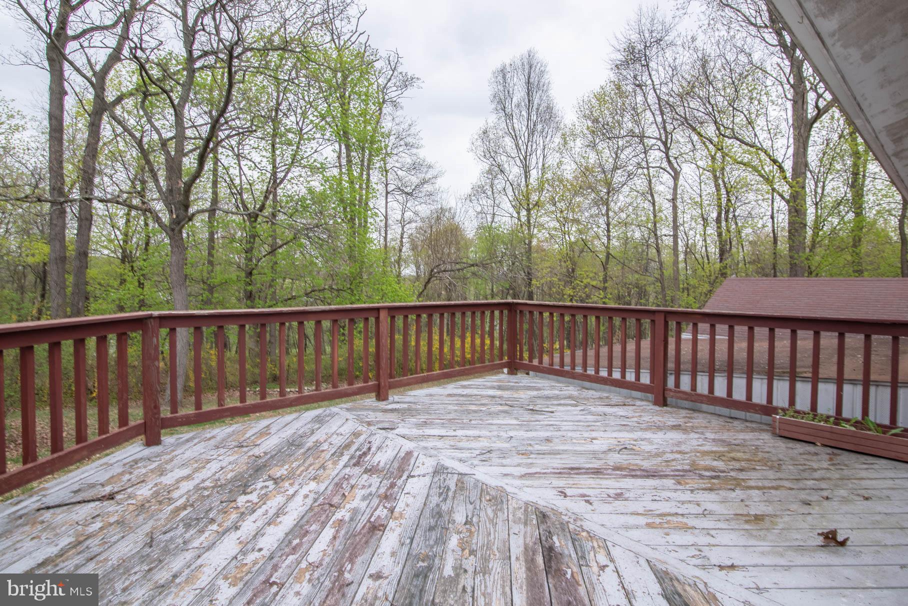 5061 Rippling Run Road Red Lion, PA 17356 - Photo 35 of 44 a balcony with trees in front of it