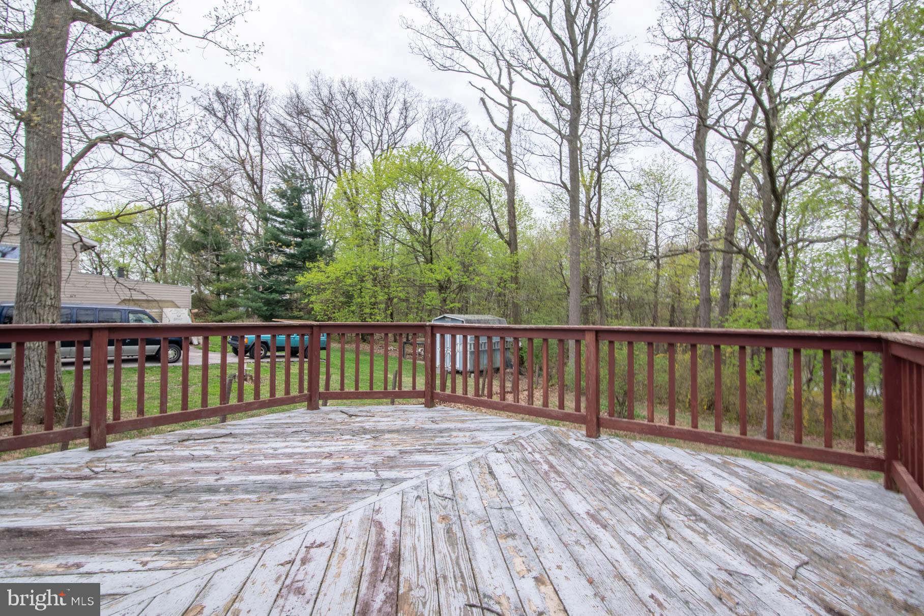 5061 Rippling Run Road Red Lion, PA 17356 - Photo 36 of 44 a view of balcony with wooden floor and fence