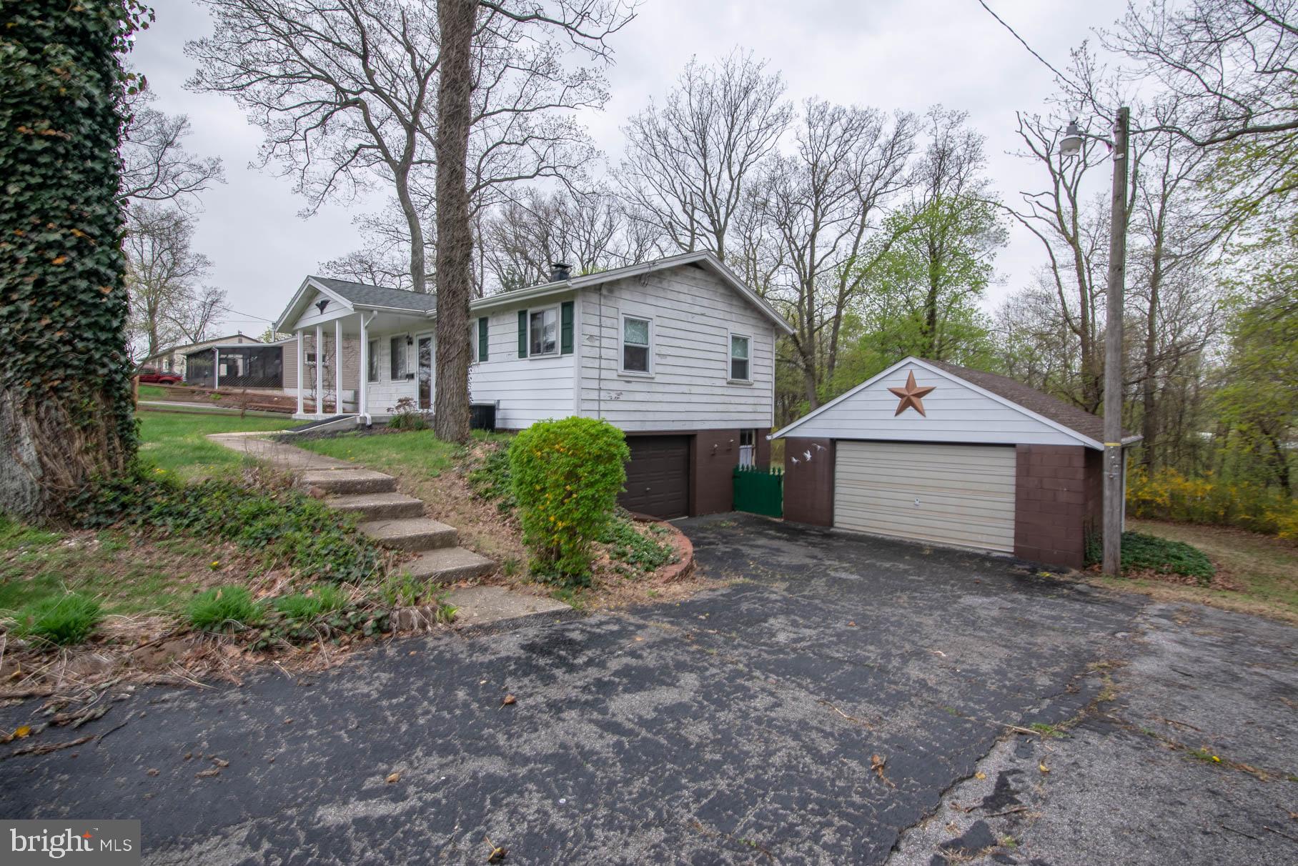 5061 Rippling Run Road Red Lion, PA 17356 - Photo 5 of 44 a view of a house with a yard and large trees