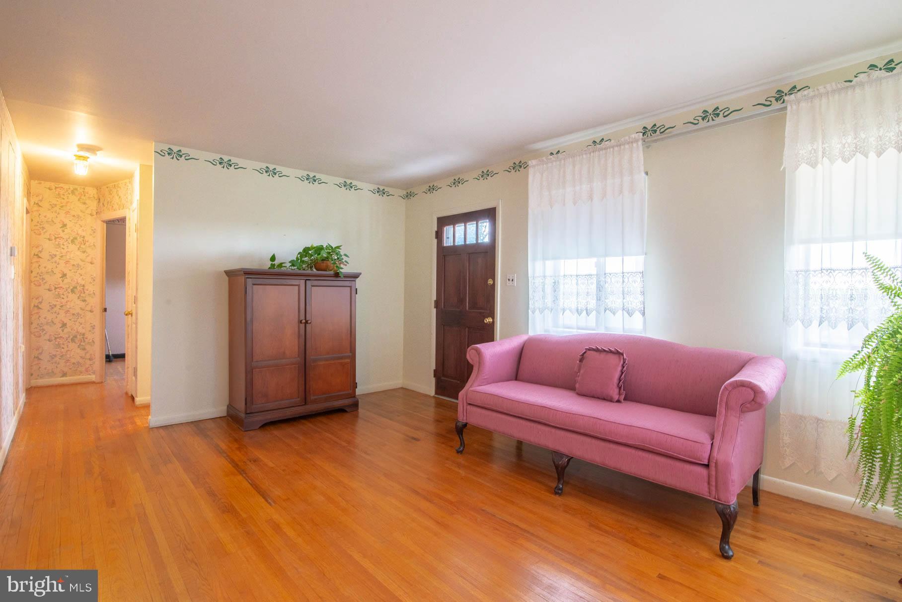 5061 Rippling Run Road Red Lion, PA 17356 - Photo 6 of 44 a spacious bedroom with a bed and a couch